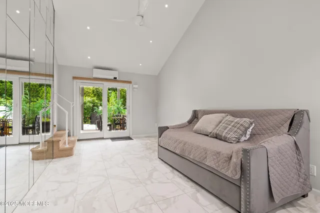 a lobby with furniture and floor to ceiling window