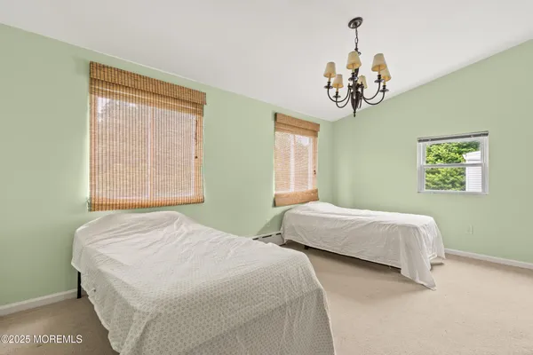 a view of a backyard with table and chairs and potted plants