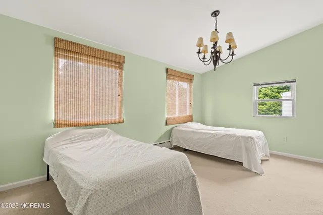 a view of a backyard with table and chairs and potted plants
