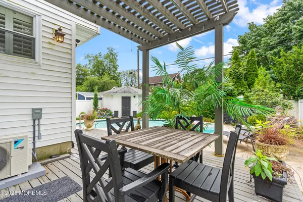 a view of a patio with swimming pool table and chairs