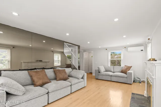 a view of a living room kitchen and a wooden floor