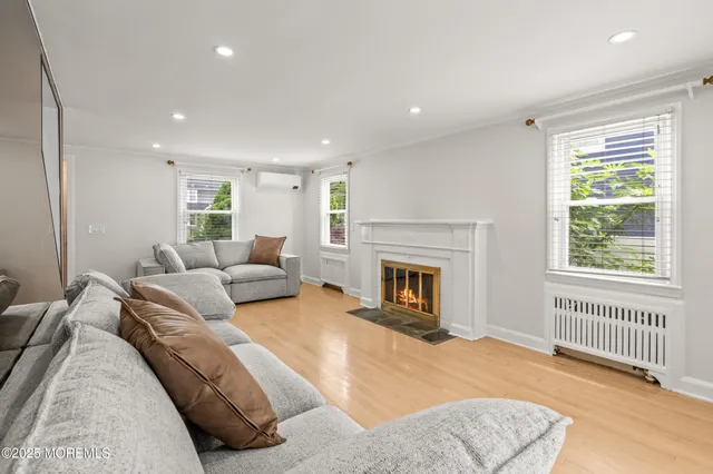 a spacious bedroom with a large bed and a fireplace