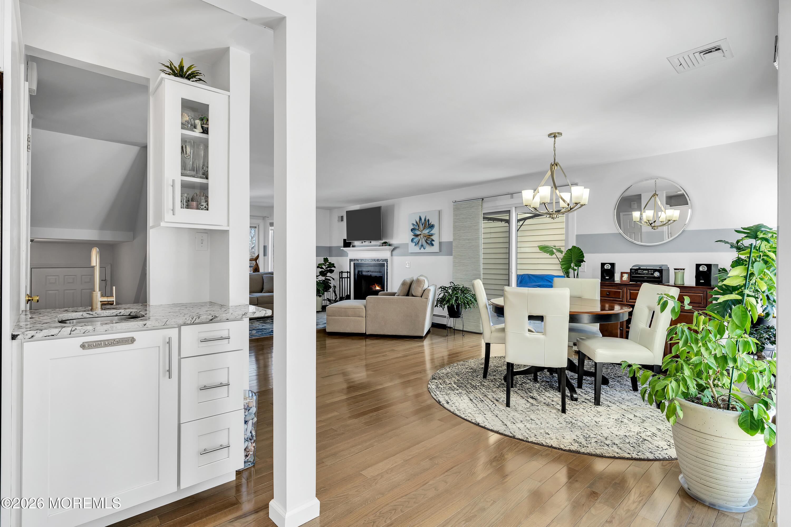 580 Patten Avenue, Unit 14 Long Branch, NJ 07740 - Photo 17 of 29 a living room with furniture kitchen and a chandelier