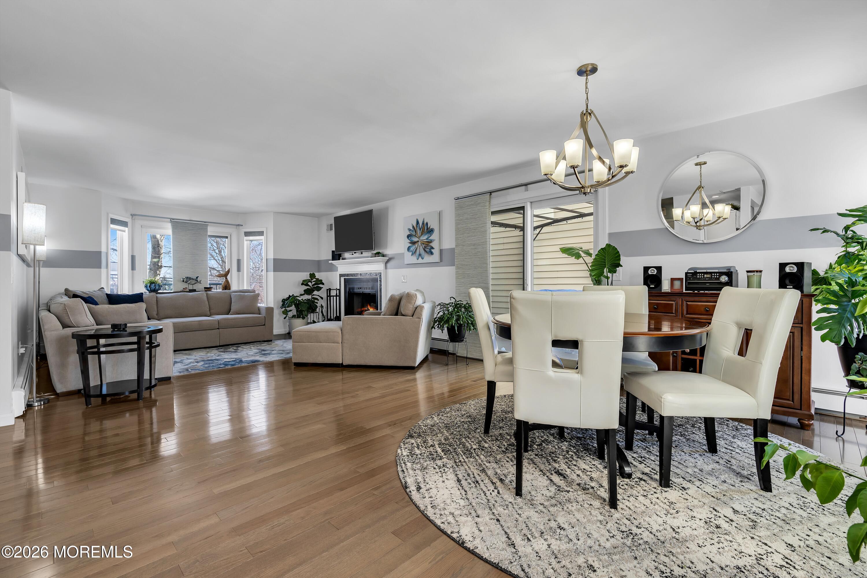 580 Patten Avenue, Unit 14 Long Branch, NJ 07740 - Photo 19 of 29 a living room with furniture chandelier and kitchen view