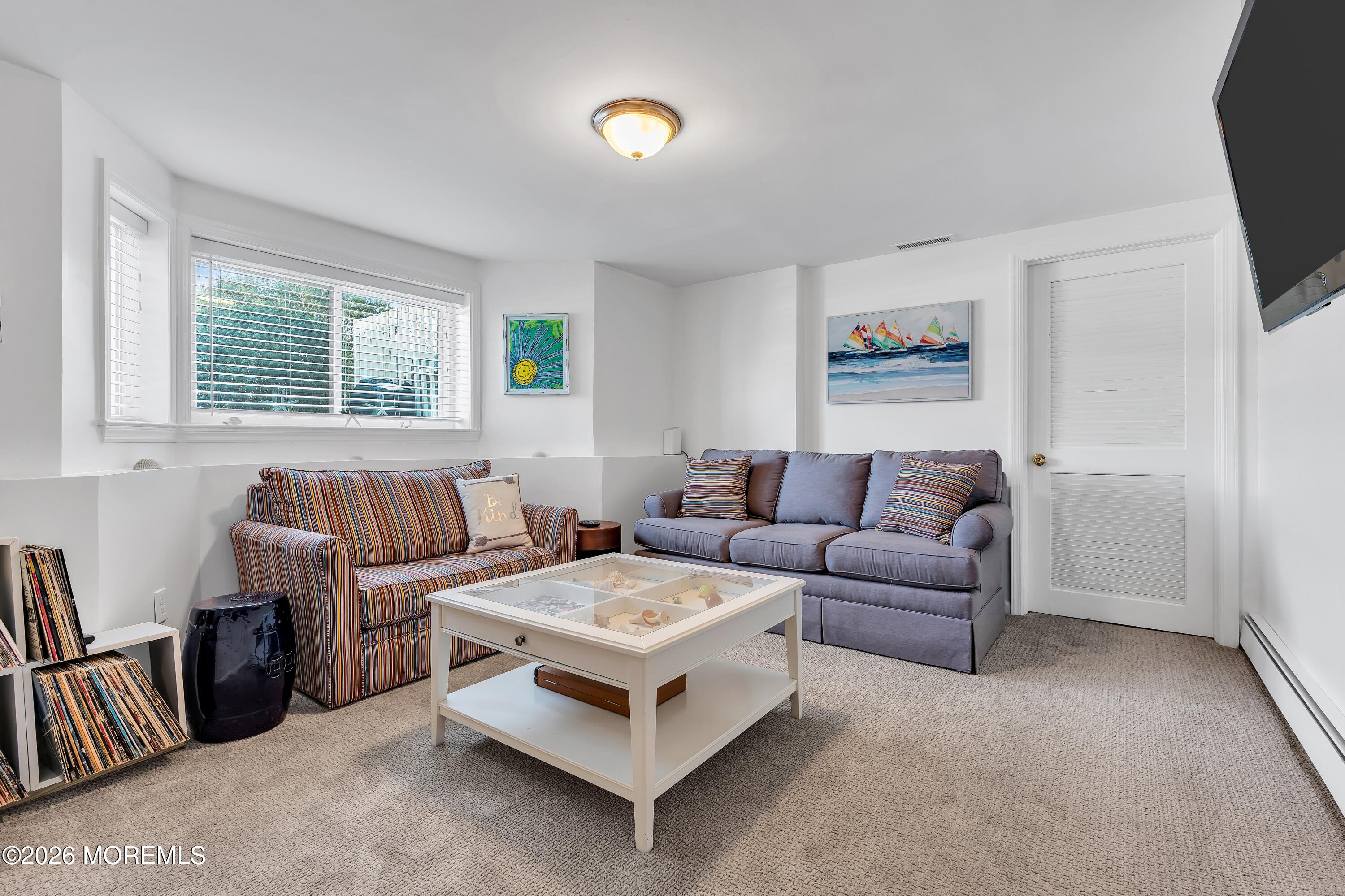 580 Patten Avenue, Unit 14 Long Branch, NJ 07740 - Photo 22 of 29 a living room with furniture and a window