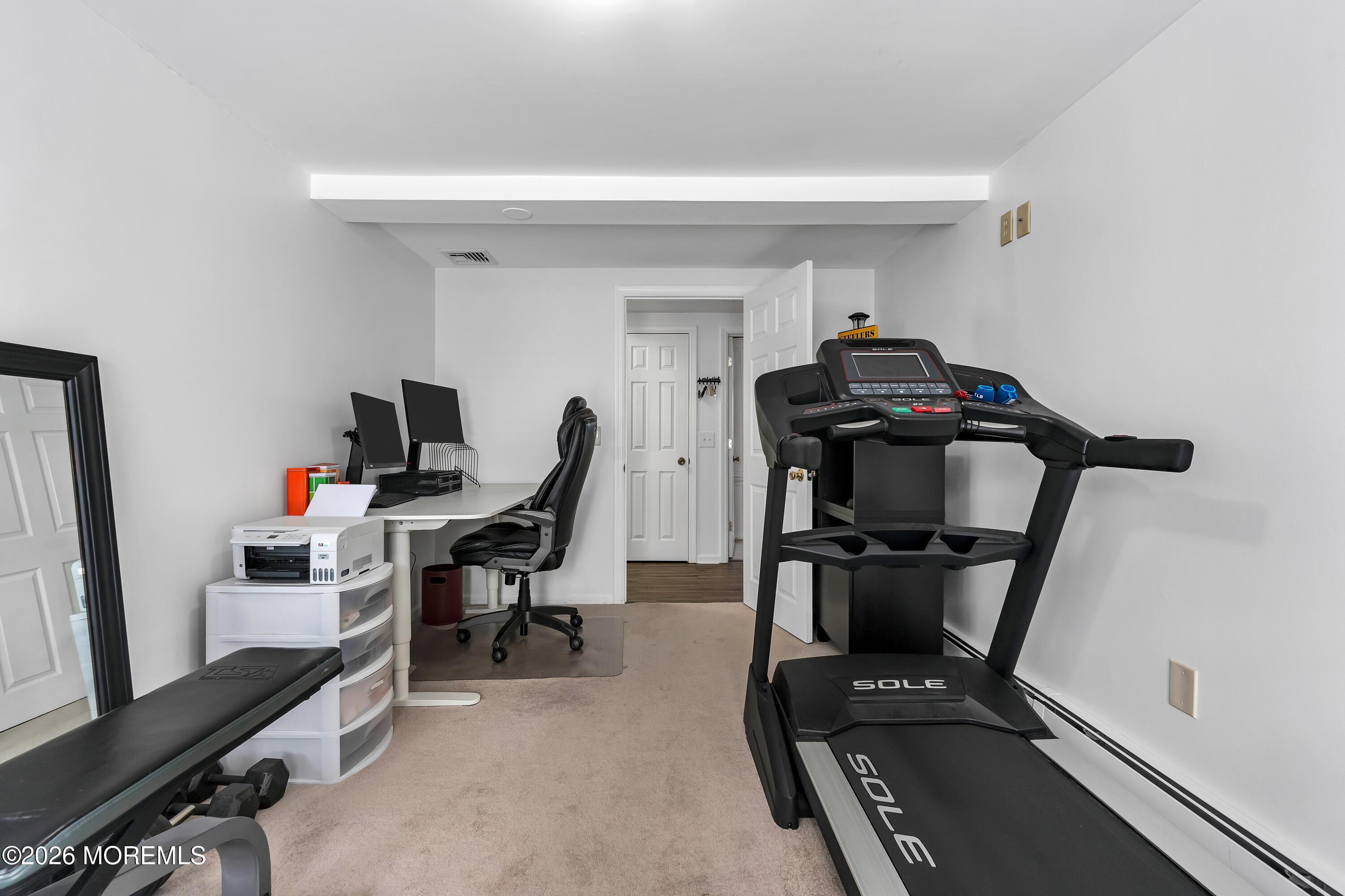 580 Patten Avenue, Unit 14 Long Branch, NJ 07740 - Photo 26 of 29 a view of a workspace with furniture and a window