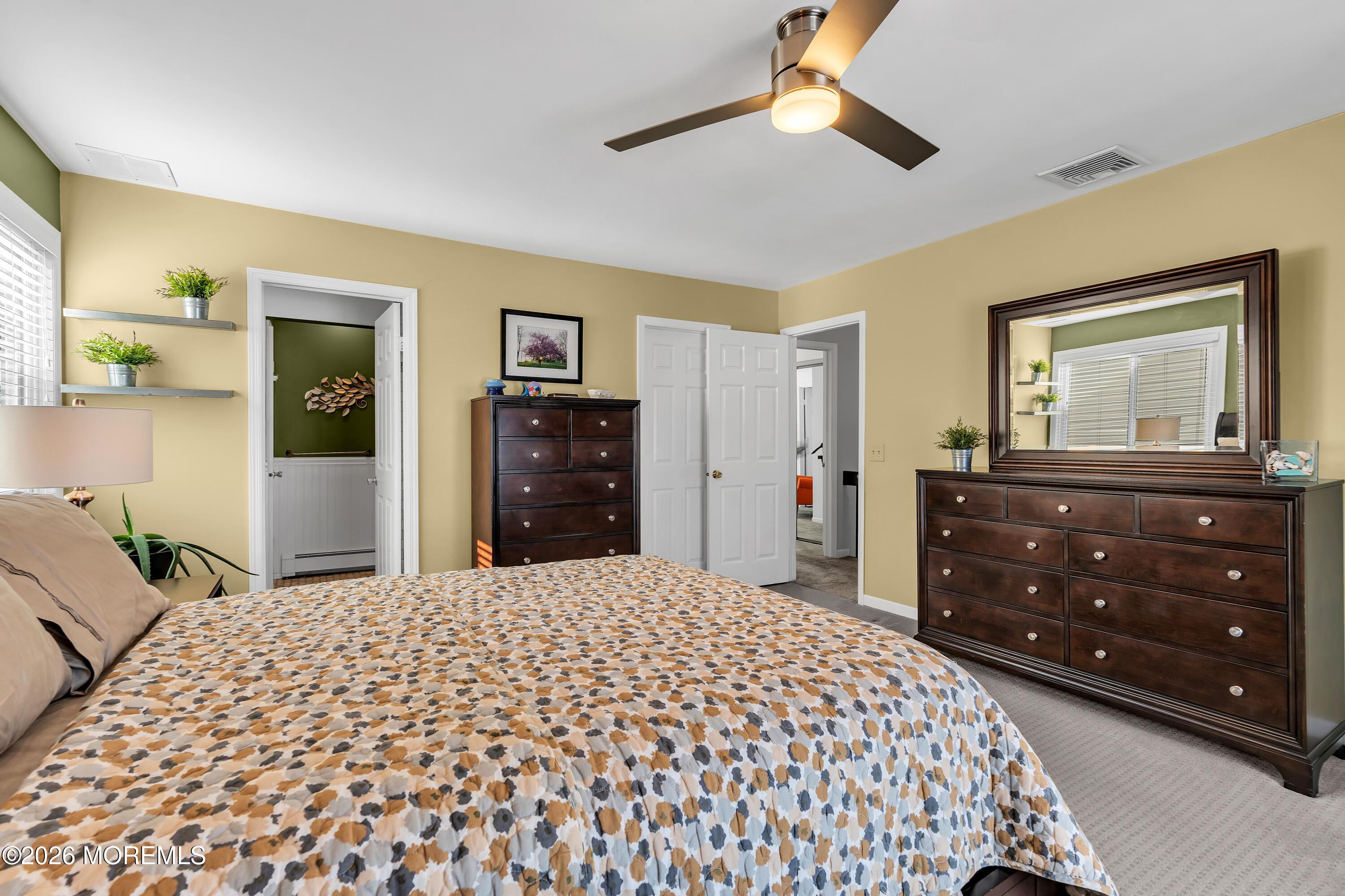 580 Patten Avenue, Unit 14 Long Branch, NJ 07740 - Photo 7 of 29 a bedroom with a bed and a dresser