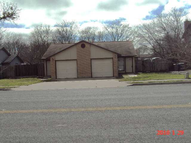4803 Teri Road Austin, TX 78744 - Photo 1 of 1 a view of a house with a yard