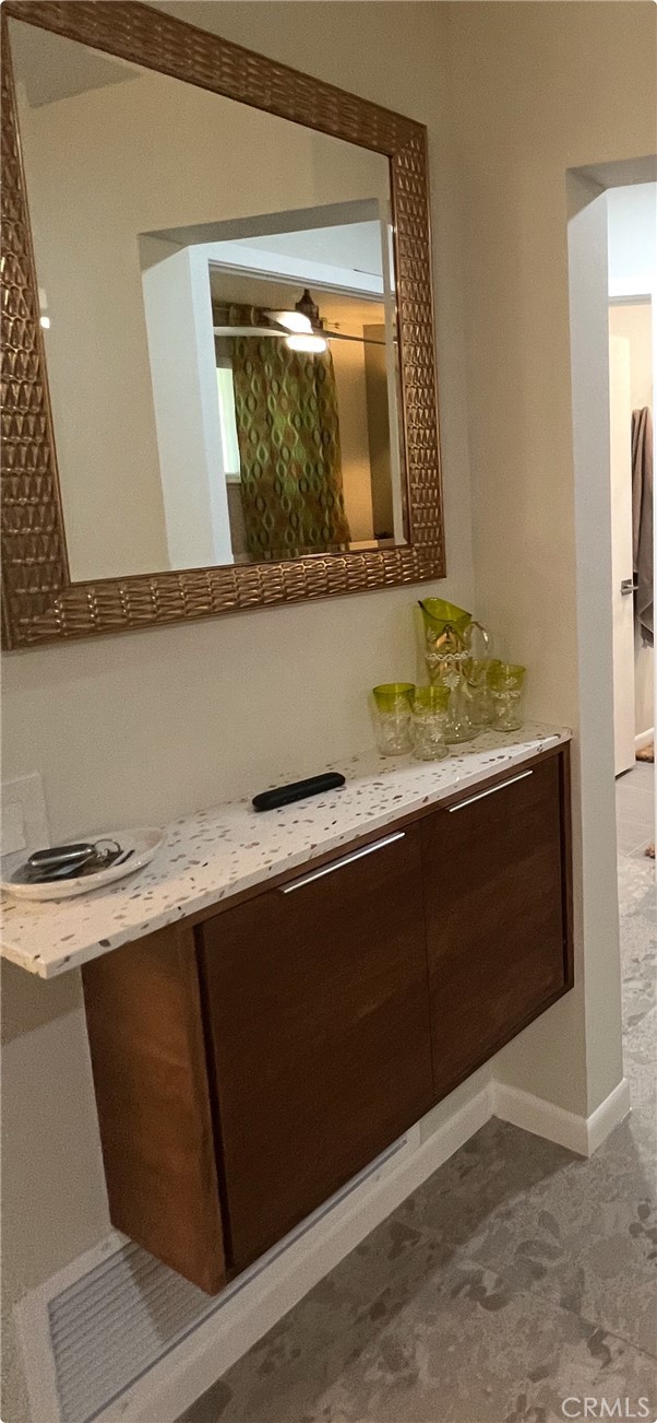 72724 Eagle Road, Unit 1 Palm Desert, CA 92260 - Photo 17 of 30 a room with a sink and a mirror