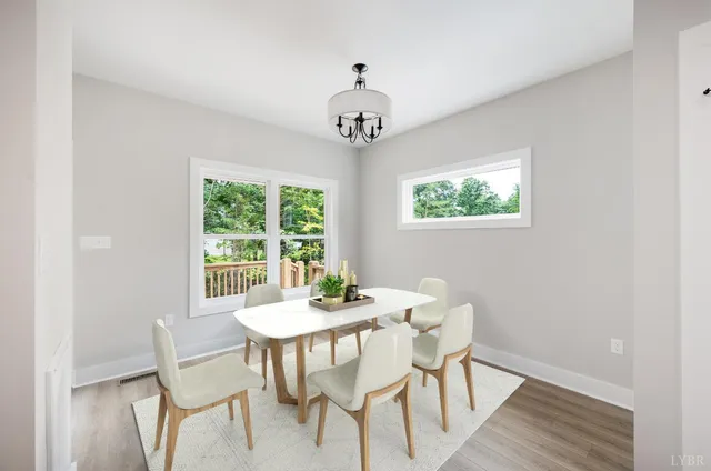 a dining room with furniture window wooden floor