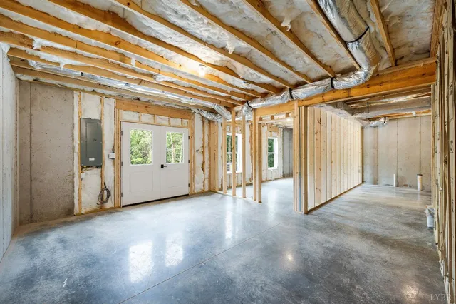 a view of an empty room with a windows