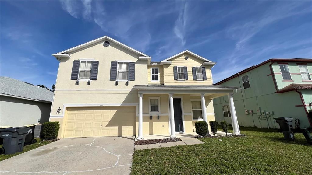 1429 Pine Ridge Drive Davenport, FL 33896 - Photo 1 of 1 a front view of a house with a yard