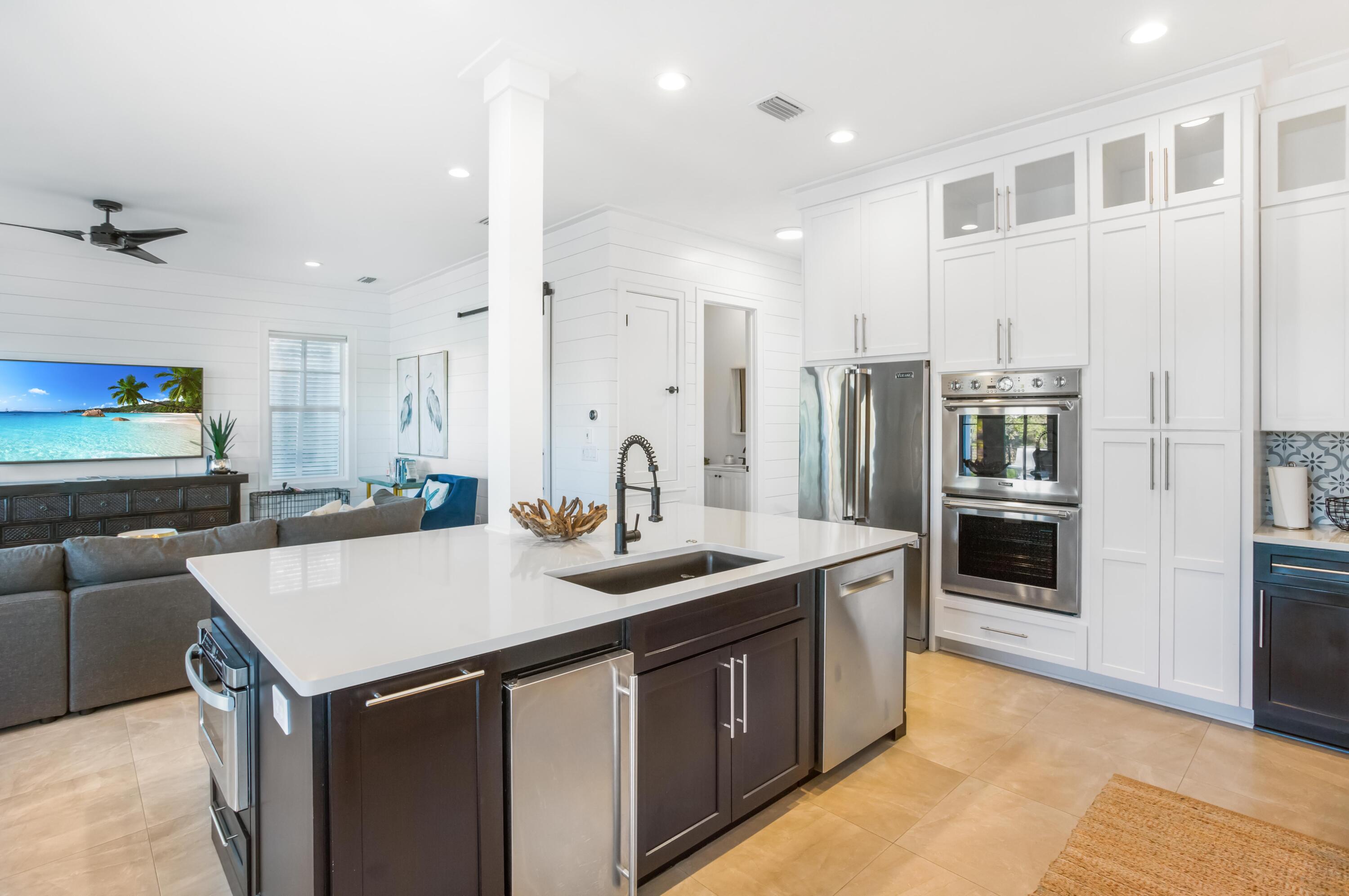 4627 Sunset Pointe Destin, FL 32541 - Photo 13 of 64 a kitchen that has a sink and a stove in it