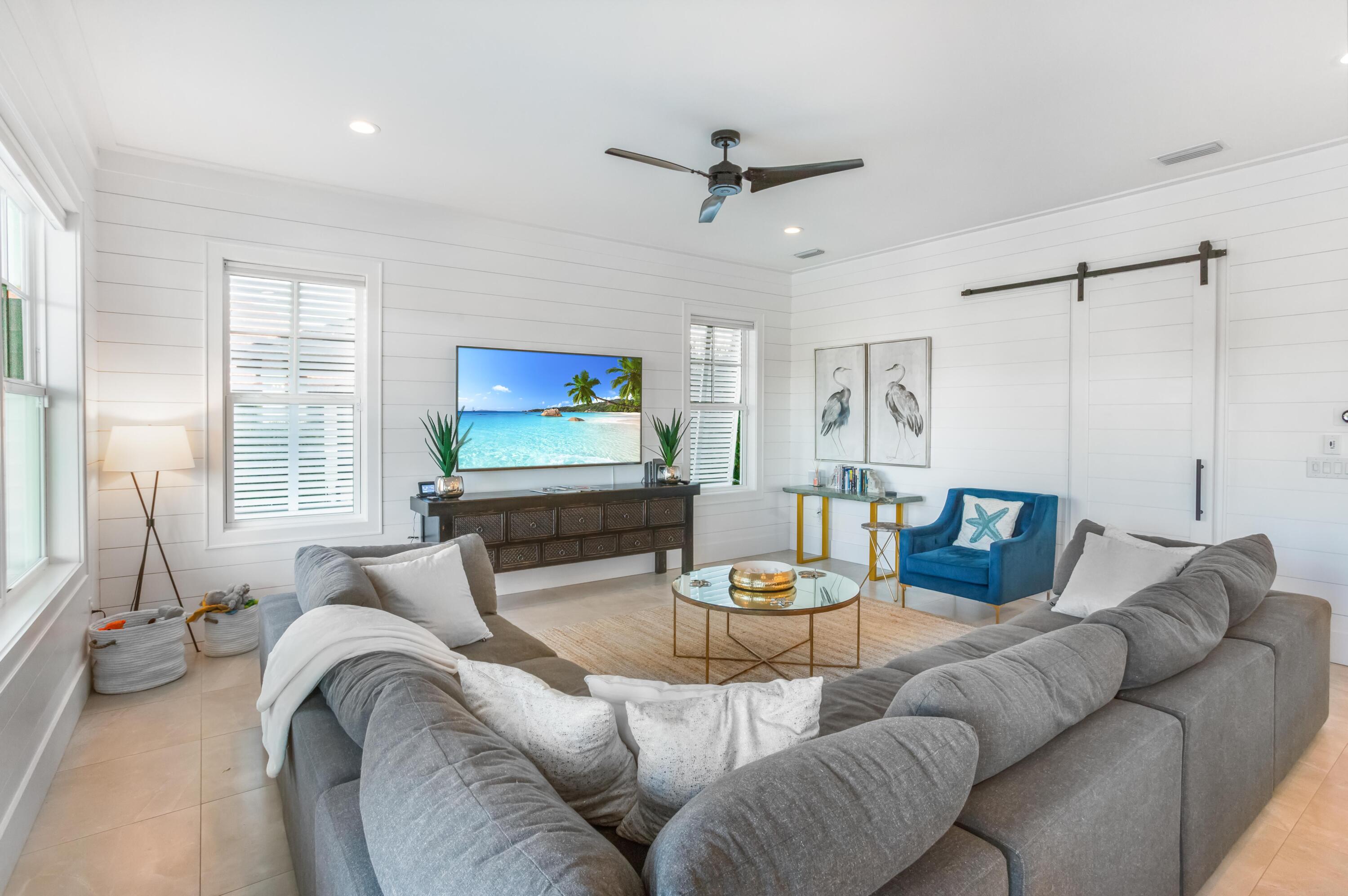 4627 Sunset Pointe Destin, FL 32541 - Photo 21 of 64 a living room with furniture and a flat screen tv