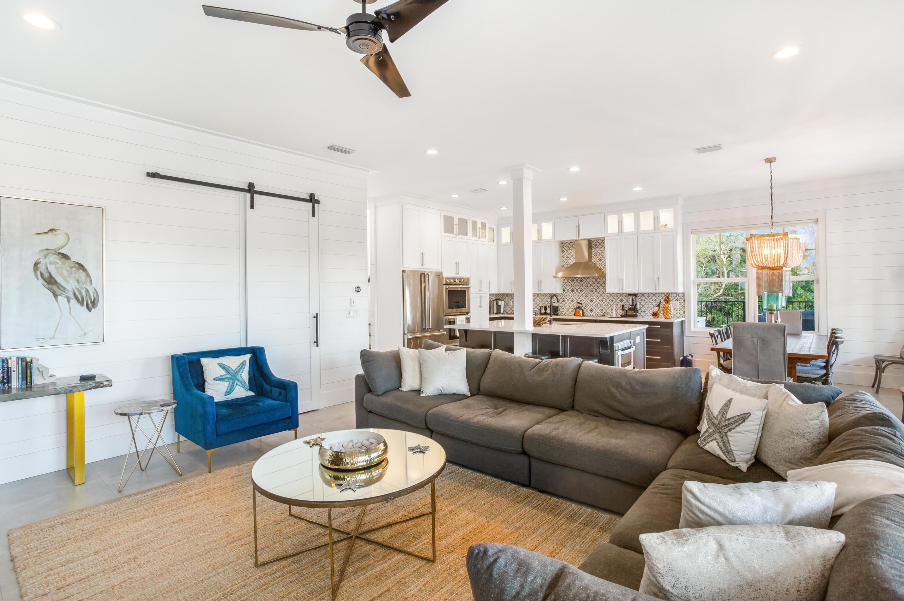 4627 Sunset Pointe Destin, FL 32541 - Photo 22 of 64 a living room with furniture and a wooden floor