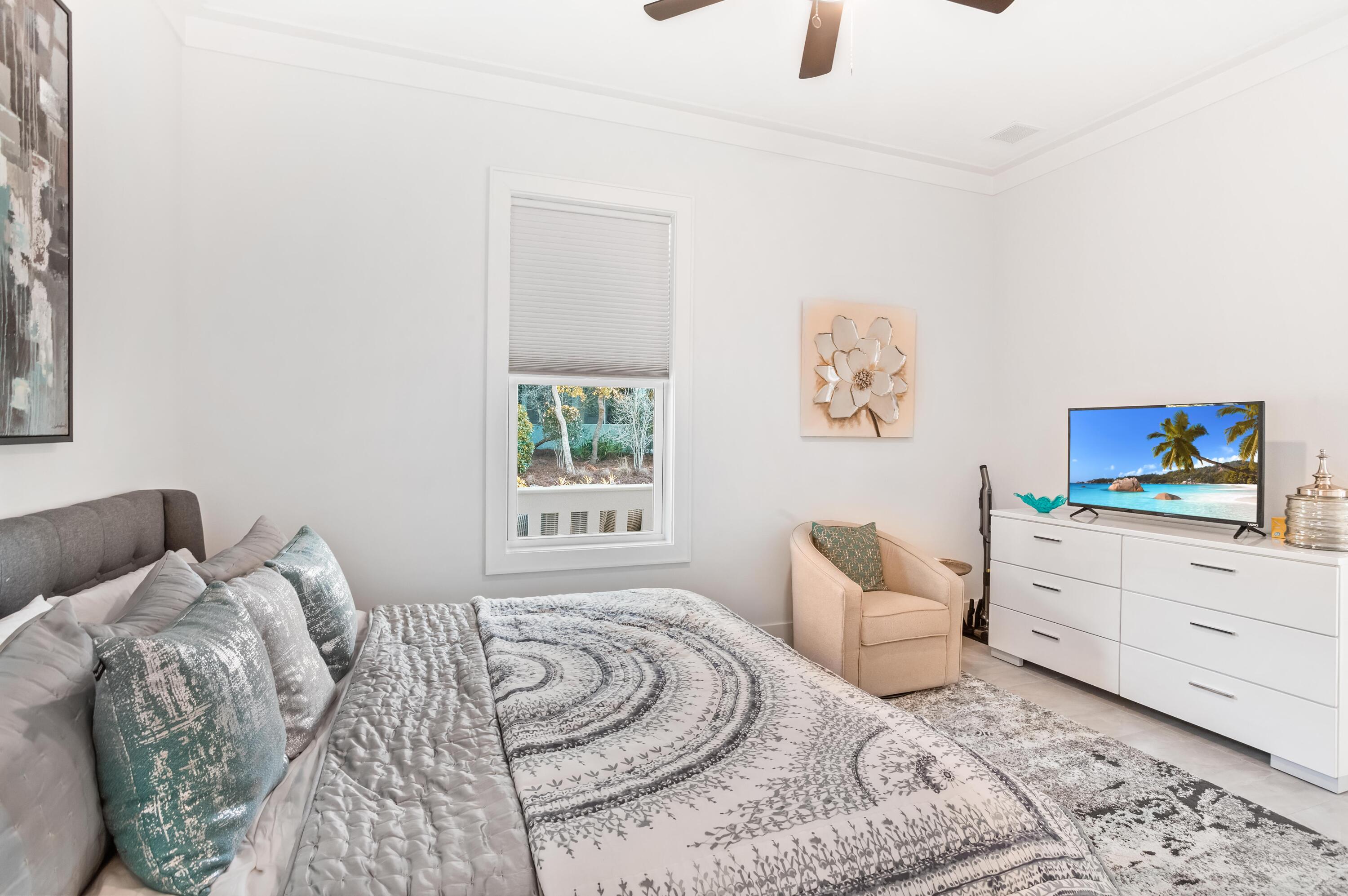 4627 Sunset Pointe Destin, FL 32541 - Photo 28 of 64 a bedroom with a bed and a couch