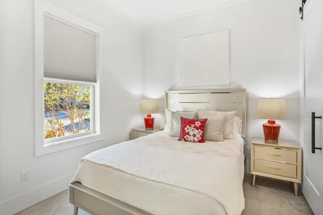 a view of a dining room with furniture and a potted plant