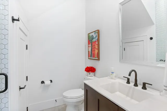 a spacious bedroom with a bed and a table