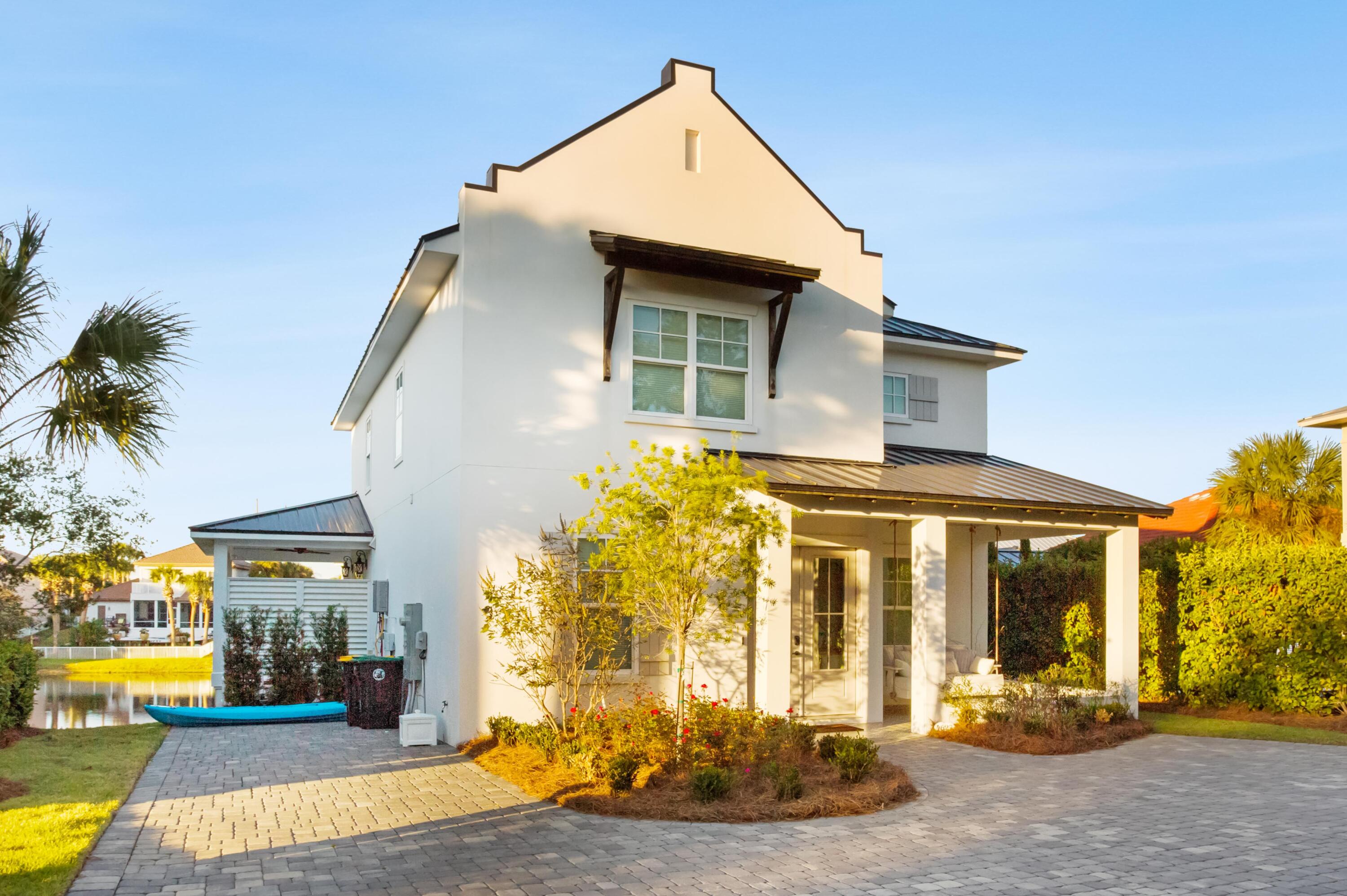 4627 Sunset Pointe Destin, FL 32541 - Photo 4 of 64 a front view of a house with a yard