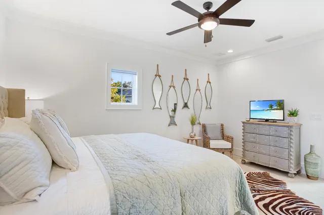 a bedroom with a bed and a tv