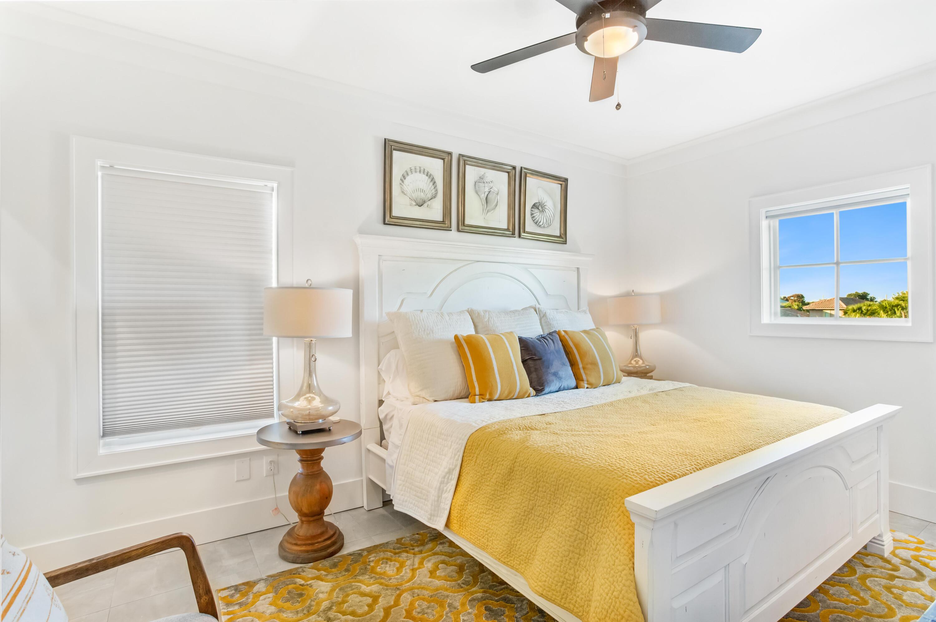 4627 Sunset Pointe Destin, FL 32541 - Photo 44 of 64 a bed sitting in a bedroom next to a window