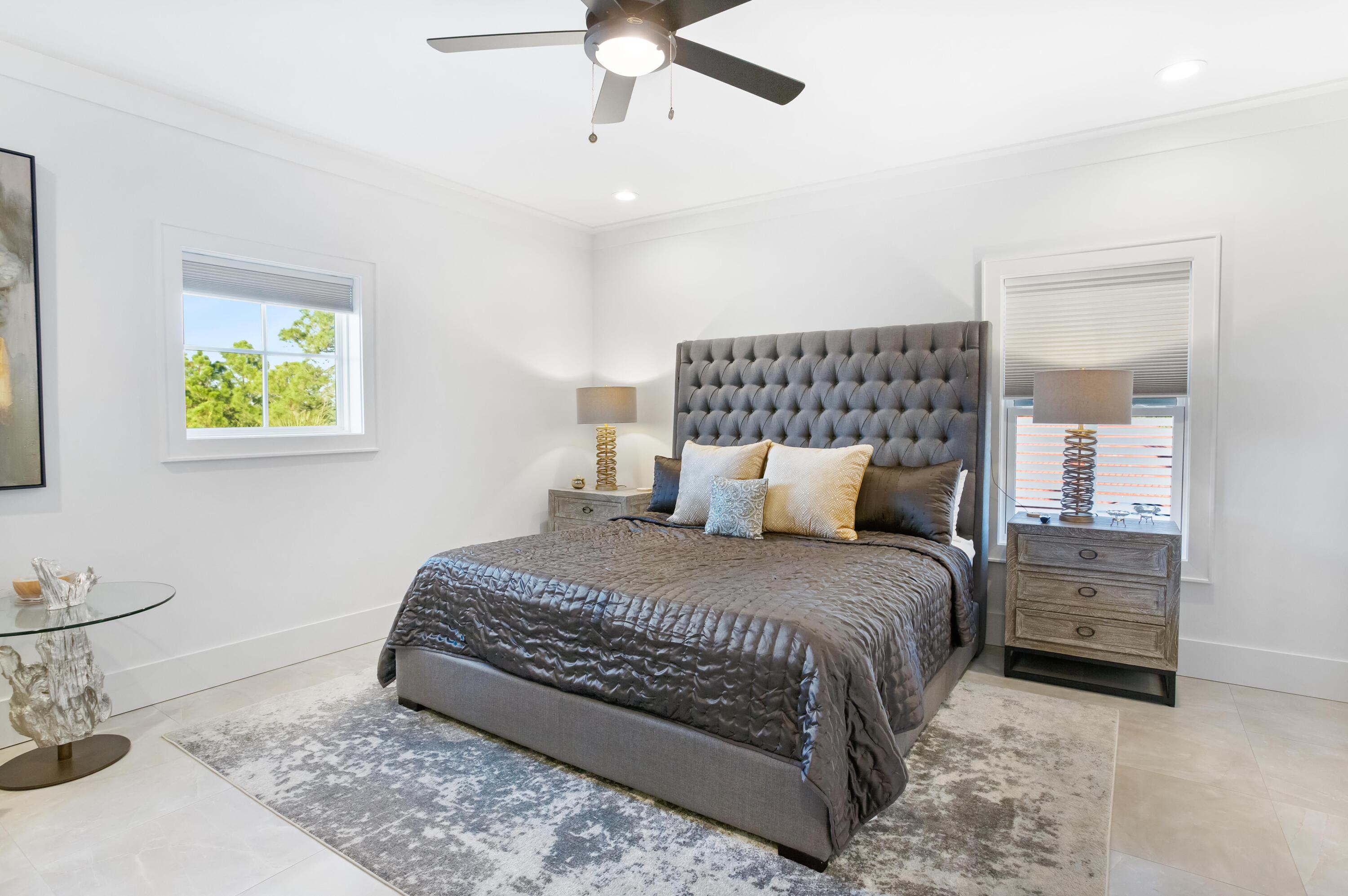 4627 Sunset Pointe Destin, FL 32541 - Photo 48 of 64 a bedroom with a bed and painting on the wall