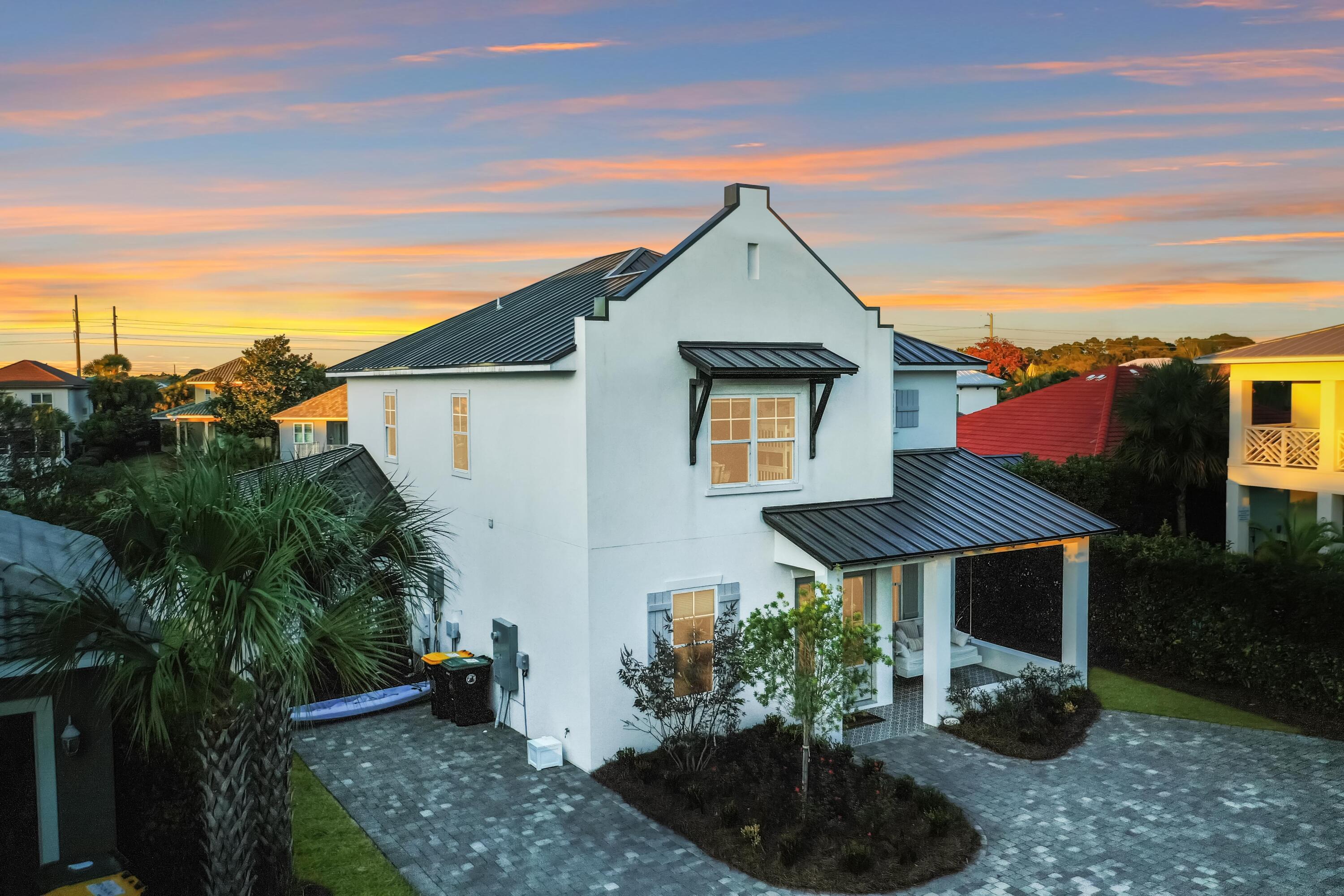 4627 Sunset Pointe Destin, FL 32541 - Photo 5 of 64 a front view of a house with a yard
