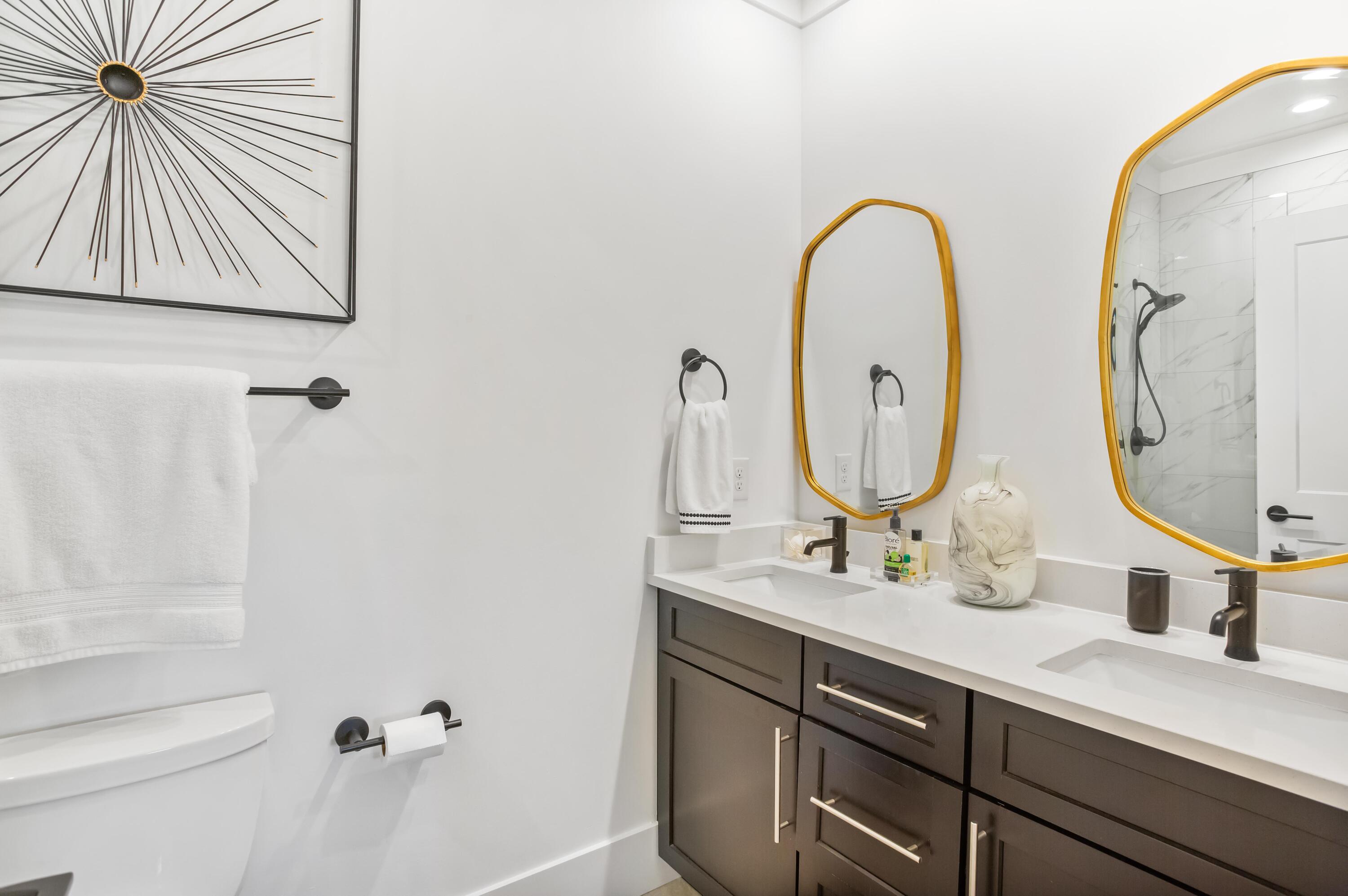 4627 Sunset Pointe Destin, FL 32541 - Photo 51 of 64 a bathroom with a sink and a mirror