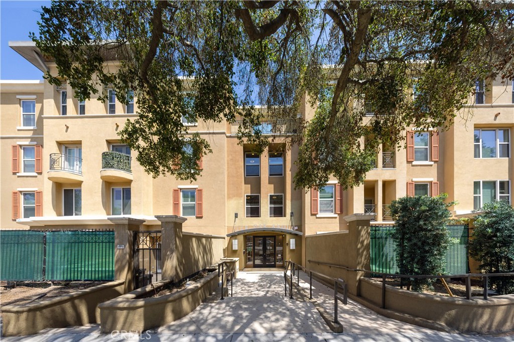 a view of a building with a tree