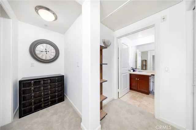 a view of a hallway with entryway door