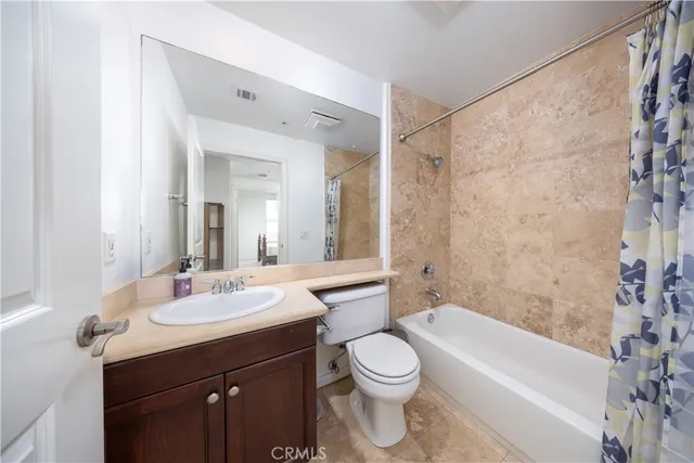 a bathroom with a sink a toilet and bathtub