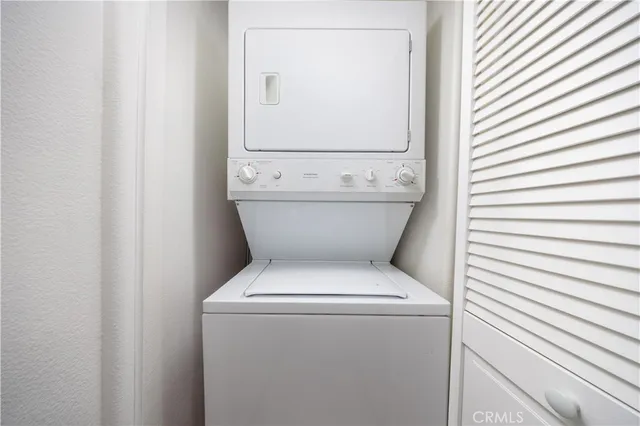 a bed room with a bed and a chandelier