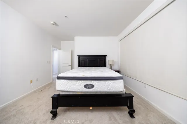 a spacious bathroom with a double vanity sink a large mirror a shower and bathtub