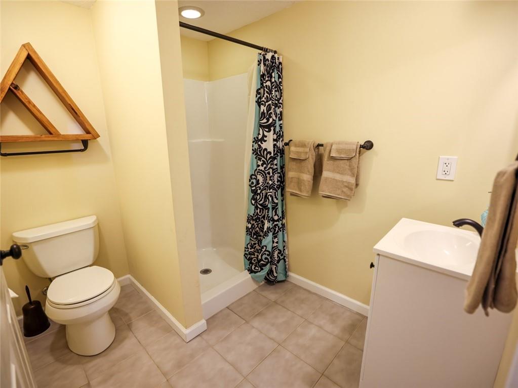 1381 Logan Road Gibsonia, PA 15044 - Photo 13 of 24 a bathroom with a toilet and a shower