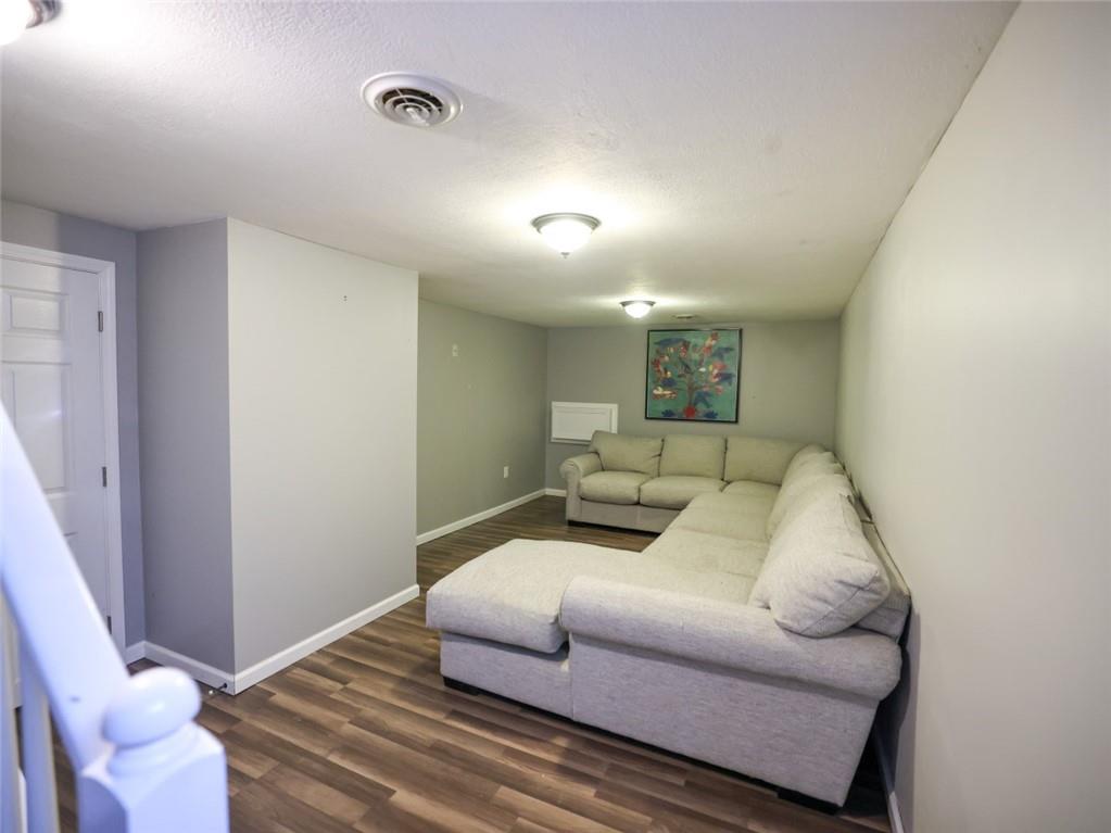 1381 Logan Road Gibsonia, PA 15044 - Photo 23 of 24 a living room with furniture and a wooden floor