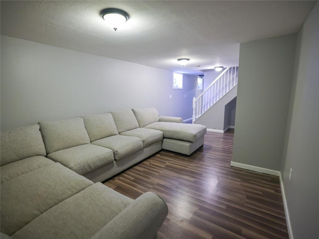 1381 Logan Road Gibsonia, PA 15044 - Photo 7 of 24 a living room with furniture and a wooden floor