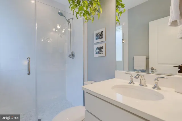 a bedroom with a bed and a potted plant