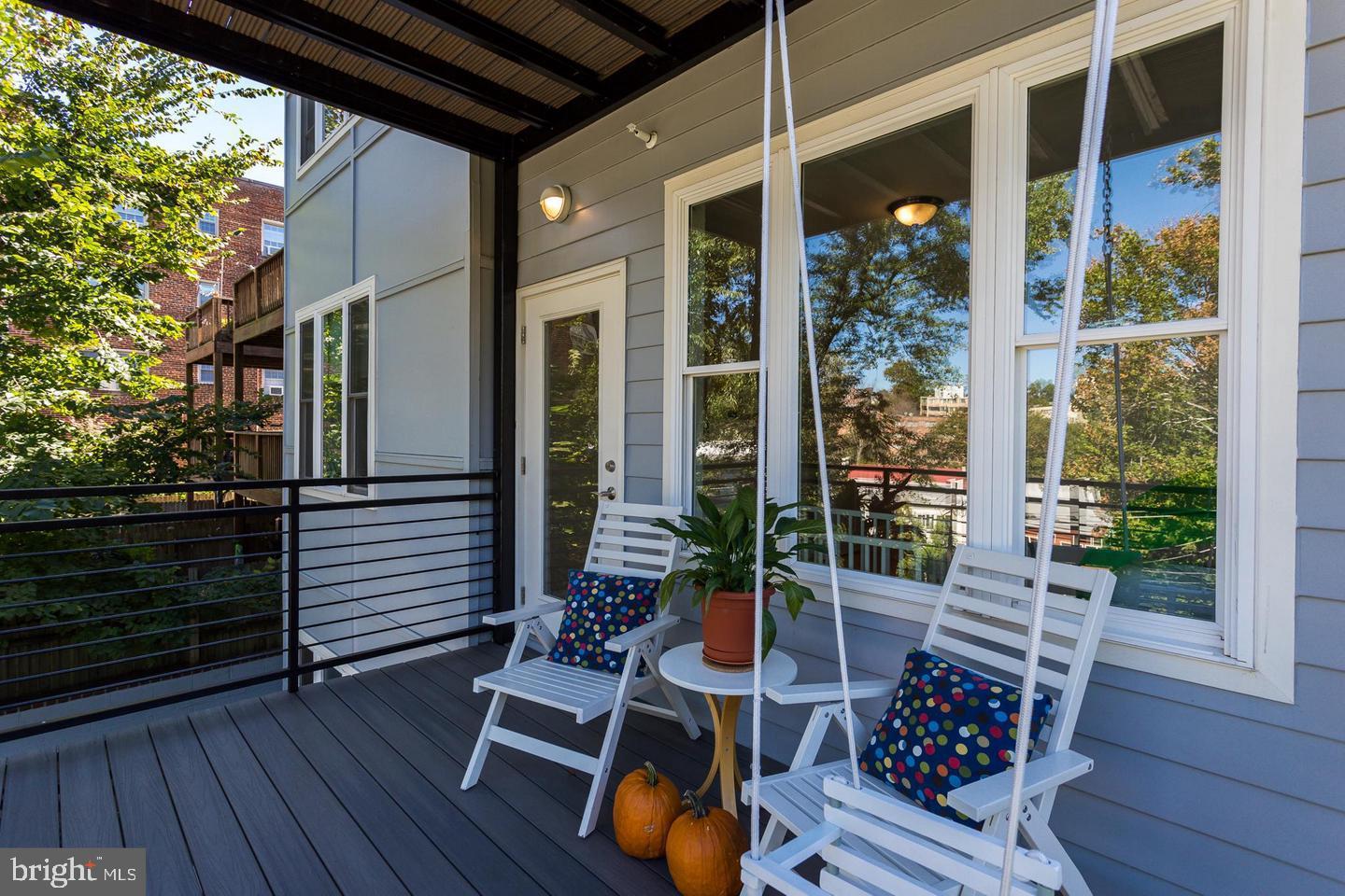 3937 Davis Place Northwest, Unit 3 Washington, DC 20007 - Photo 12 of 20 a backyard of a house with wooden floor and outdoor seating