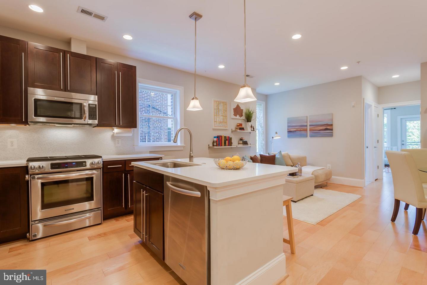 3937 Davis Place Northwest, Unit 3 Washington, DC 20007 - Photo 3 of 20 a kitchen with a stove sink and microwave