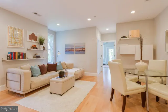 a living room with furniture and a table