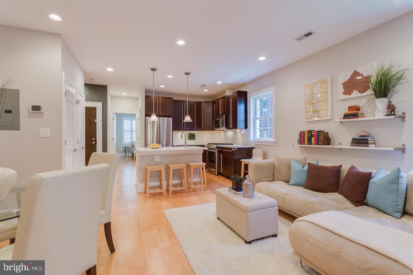 3937 Davis Place Northwest, Unit 3 Washington, DC 20007 - Photo 20 of 20 a living room with furniture and a view of kitchen