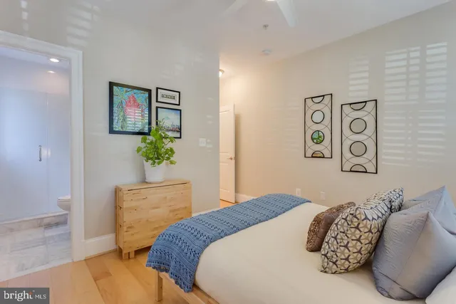 a bedroom with a bed and a window