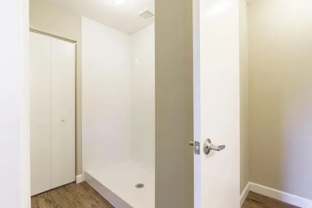 a bathroom with a sink toilet vanity and bathtub