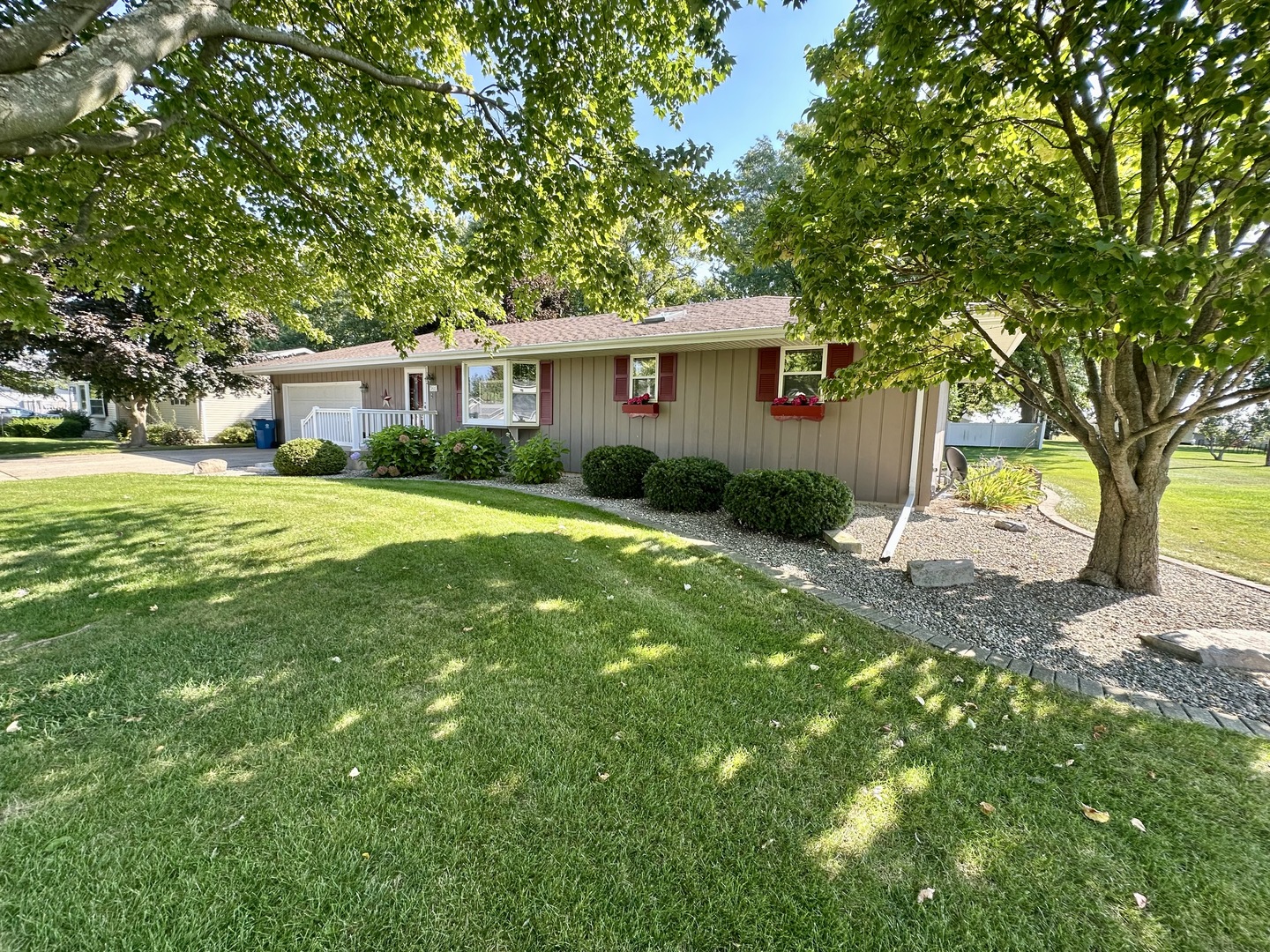203 North Pleasant Street Ohio, IL 61349 - Photo 1 of 2 a front view of a house with garden