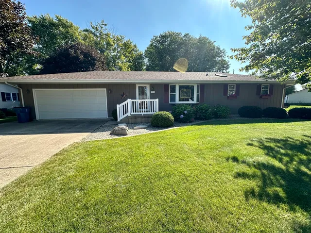 a view of a yard in front of a house