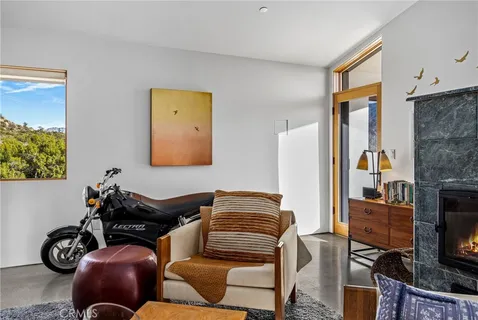 a room with wooden floors and wooden cabinets