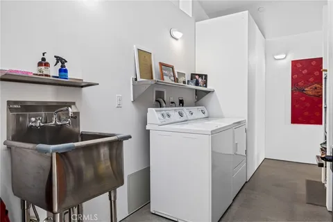 a bedroom with furniture and a rug