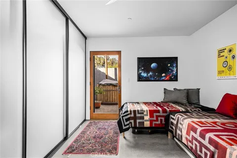a view of a backyard with furniture and a grill