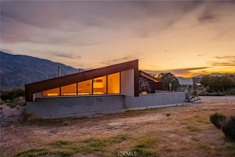 a backyard of a house with wooden fence