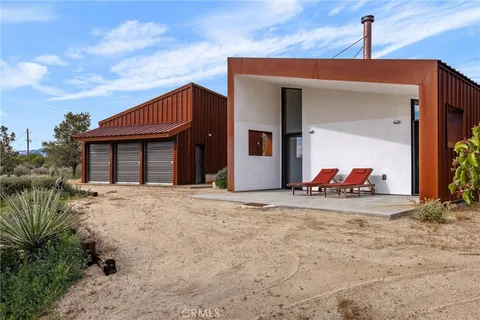 a house view with a backyard space